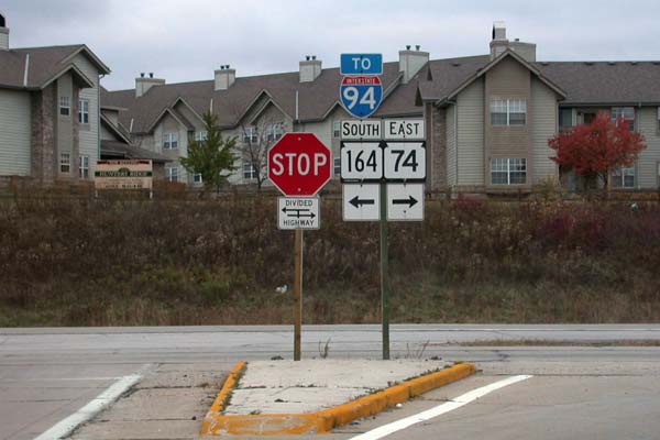 Signs at end of ramp from STH-190 to STH-164 & 74.